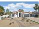 Charming home with desert landscaping, terra cotta tile roof, and 2 car garage at 5704 E Estrid Ave, Scottsdale, AZ 85254