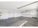 Bright and roomy garage with built-in storage, water heater, and ample space for parking and projects at 5704 E Estrid Ave, Scottsdale, AZ 85254