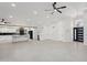 Spacious living room featuring an open layout, modern finishes, and sleek tile flooring at 5704 E Estrid Ave, Scottsdale, AZ 85254