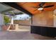 Covered patio featuring stone countertops, an outdoor sink, built in barbeque and an abundance of cabinet space at 5704 E Estrid Ave, Scottsdale, AZ 85254