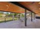 Spacious covered patio with an outdoor kitchen, ceiling fans and manicured backyard, perfect for entertaining at 5704 E Estrid Ave, Scottsdale, AZ 85254