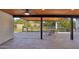 View from a covered patio showcasing a large backyard and outdoor dining space, creating a relaxing retreat at 5704 E Estrid Ave, Scottsdale, AZ 85254