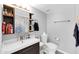 Bright bathroom featuring modern vanity, toilet, mirror and blue shower curtain at 5905 N 83Rd St, Scottsdale, AZ 85250
