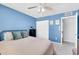 Bedroom with blue walls, a ceiling fan, closet, and carpeted floors at 5905 N 83Rd St, Scottsdale, AZ 85250