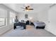 Multi-purpose room with bed and desk area, ceiling fan, and large window at 5905 N 83Rd St, Scottsdale, AZ 85250