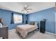 Cozy bedroom with blue walls, a ceiling fan, and carpeted floors at 5905 N 83Rd St, Scottsdale, AZ 85250