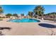 Community pool with lounge chairs, tables and umbrellas, perfect for relaxation at 5905 N 83Rd St, Scottsdale, AZ 85250