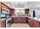 Well-equipped kitchen with stainless steel appliances and granite countertops at 5905 N 83Rd St, Scottsdale, AZ 85250