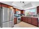 Updated kitchen featuring stainless steel appliances, granite countertops, and ample cabinet space at 5905 N 83Rd St, Scottsdale, AZ 85250