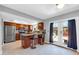 Modern kitchen with stainless steel appliances, granite countertops, and island seating at 5905 N 83Rd St, Scottsdale, AZ 85250