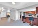 Open-concept living area with kitchen view, island seating, and neutral color scheme at 5905 N 83Rd St, Scottsdale, AZ 85250