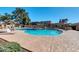 Enjoy the community pool with lounge chairs and umbrellas, perfect for relaxation and outdoor fun at 5905 N 83Rd St, Scottsdale, AZ 85250