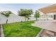 Lush backyard featuring well-maintained lawn, mature trees, and a pool at 62 N Amber Ct, Chandler, AZ 85225