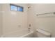 Bright bathroom featuring a shower-over-tub combination and a modern, streamlined design at 62 N Amber Ct, Chandler, AZ 85225
