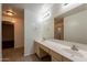Bright bathroom featuring a double sink vanity and large mirror at 62 N Amber Ct, Chandler, AZ 85225