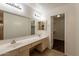 Bathroom featuring double sinks, vanity, and tile flooring, and access to a walk-in closet at 62 N Amber Ct, Chandler, AZ 85225