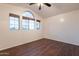 Bedroom with windows allowing ample sunlight and hardwood floors at 62 N Amber Ct, Chandler, AZ 85225