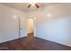 Spacious bedroom with hardwood floors, ceiling fan and a closet at 62 N Amber Ct, Chandler, AZ 85225