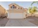 Two-story home featuring a two-car garage, desert landscaping, and a neutral color palette at 62 N Amber Ct, Chandler, AZ 85225
