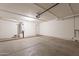 A spacious garage with ample room for parking and storage with a modern garage door system at 62 N Amber Ct, Chandler, AZ 85225