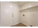 A functional laundry room with easy access to hookups and featuring durable flooring at 62 N Amber Ct, Chandler, AZ 85225
