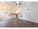 Open floor plan featuring a modern kitchen and living room, with wood floors and bright natural light at 62 N Amber Ct, Chandler, AZ 85225