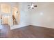 Bright living room featuring high ceilings, wood floors, and staircase access to the upper level at 62 N Amber Ct, Chandler, AZ 85225