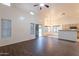 Spacious living room featuring wood floors, large windows, and views of the outdoor area at 62 N Amber Ct, Chandler, AZ 85225