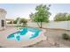 Private backyard pool surrounded by patio, greenery and landscaping offering a serene outdoor experience at 62 N Amber Ct, Chandler, AZ 85225