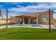 Backyard with a pool, patio, and synthetic grass at 730 E Tanya Trl, Phoenix, AZ 85086