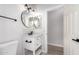 Stylish bathroom featuring single sink white vanity, with modern fixtures and decorative mirrors at 730 E Tanya Trl, Phoenix, AZ 85086