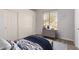 Bedroom with neutral carpet and a large window that lets in plenty of natural light at 730 E Tanya Trl, Phoenix, AZ 85086