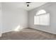 Bedroom with neutral carpet, a large window and a closet with sliding doors at 730 E Tanya Trl, Phoenix, AZ 85086