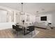 Staged dining room featuring a modern table, chairs, rug, and decorative accents at 730 E Tanya Trl, Phoenix, AZ 85086