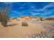 Beautiful single-story home featuring a three-car garage and native desert vegetation at 730 E Tanya Trl, Phoenix, AZ 85086