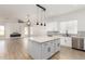 Bright open concept kitchen boasts a large island, stainless appliances, and backyard views at 730 E Tanya Trl, Phoenix, AZ 85086