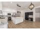 Open concept kitchen has a large island, stainless steel appliances, and black and white accents at 730 E Tanya Trl, Phoenix, AZ 85086