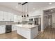 Modern kitchen boasts stainless steel appliances, white cabinetry, and a large center island at 730 E Tanya Trl, Phoenix, AZ 85086