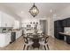 Modern kitchen features stainless steel appliances, white cabinetry, and a large island at 730 E Tanya Trl, Phoenix, AZ 85086