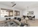 Living room with modern furnishings, large windows, wood floors, and light, neutral colors at 730 E Tanya Trl, Phoenix, AZ 85086