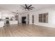 Spacious living room opens to the kitchen and showcases lots of natural light and hardwood floors at 730 E Tanya Trl, Phoenix, AZ 85086