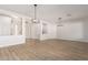 Spacious living room with hardwood floors and modern light fixtures gives an open and airy feeling at 730 E Tanya Trl, Phoenix, AZ 85086