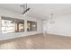 Bright and airy living room featuring expansive windows, wood floors, and white walls at 730 E Tanya Trl, Phoenix, AZ 85086