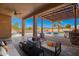 Elegant outdoor patio area with a pergola, seating, and a view of the pool at 730 E Tanya Trl, Phoenix, AZ 85086