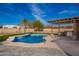 Backyard pool and outdoor kitchen area, perfect for entertaining in style at 730 E Tanya Trl, Phoenix, AZ 85086
