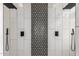 Elegant walk-in shower featuring dual shower heads and designer tile work, creating a spa-like experience at 730 E Tanya Trl, Phoenix, AZ 85086