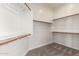 Well-organized walk-in closet with ample shelving and storage space for clothing and accessories at 730 E Tanya Trl, Phoenix, AZ 85086