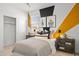 Stylish bedroom featuring a modern bed and unique wall décor at 7441 W Buckhorn Trl, Peoria, AZ 85383
