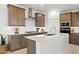 Modern kitchen with stainless steel appliances, a large island, and a stylish range hood at 7441 W Buckhorn Trl, Peoria, AZ 85383