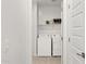 Well-lit laundry room featuring a new white washer and dryer at 7441 W Buckhorn Trl, Peoria, AZ 85383